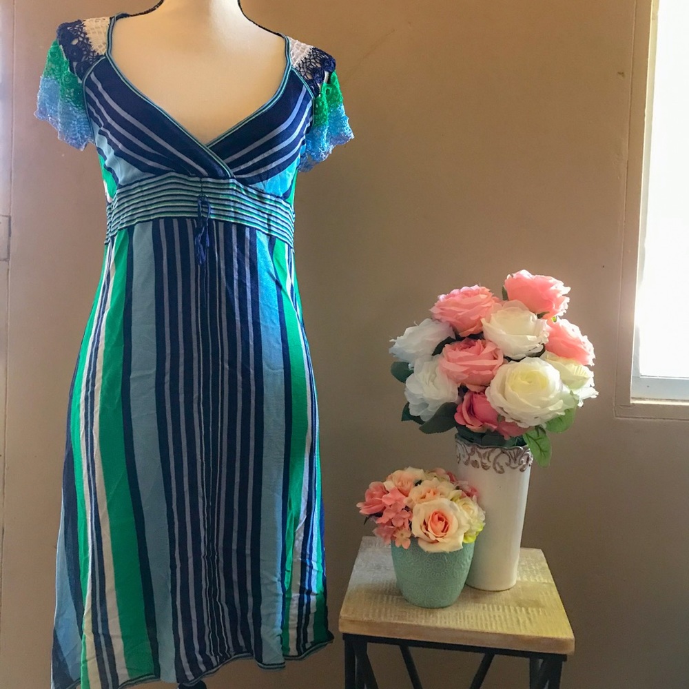Multi color Bebe dress with crochet cap sleeves.